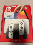 Nintendo Switch OLED + Super Mario Olympics igra - kao novo