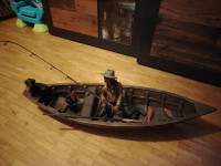 Ribar u čamcu s psom