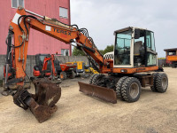 Bager na kotačima Terex TW85 težine 8600 kg. Godina 2008