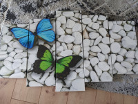 Slika od pet dijelova s leptirićima na kamenju