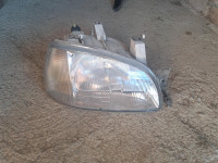 desni far clio 1 97g.