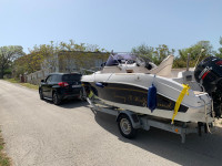 Gliser s vanbrodskim motorom i prikolica