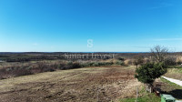 BUJE, građevinsko zemljište od 1036 m2 za kuću, pogled more