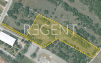 Šibenik, Unešić - građevinsko zemljište s projektom, 13459m2