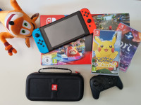 Nintendo Switch + igre + torbica + produljeno jamstvo