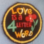 Love is a 4 LETTER WORD stariji okrugli prišivak