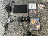 Sony Playstation 2 slim,chipiran,2 joysticka,oprema,4 igrice,memory