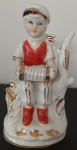 porculanska figura - dječak  sa harmonikom