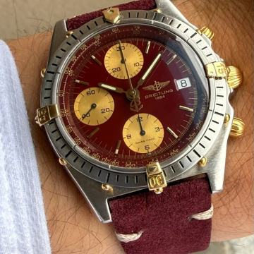 Breitling Chronomat Burgundy Dial 
Ref. B13047
Automatic
39 mm