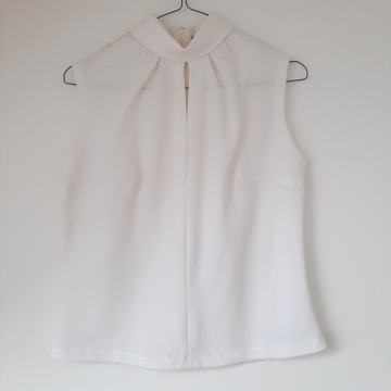 Bijela bluza top bez rukava 36