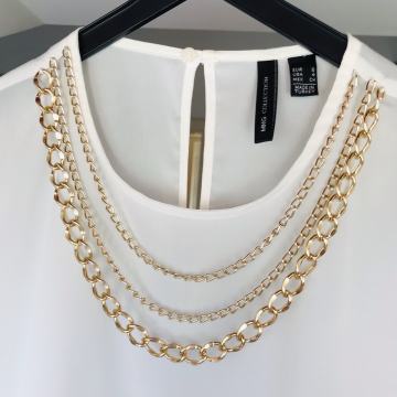 MANGO košulja s ukrasnim lancima