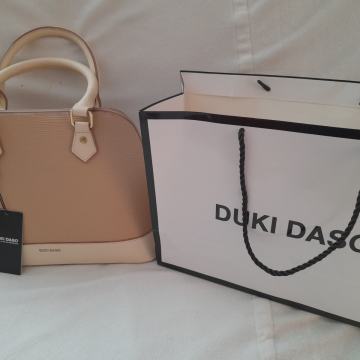 ŽENSKU TORBICU "DUKI DASO" PRODAJEM