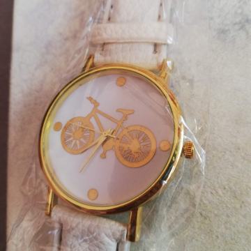 Ručni sat bijeli sa zlatnim biciklom