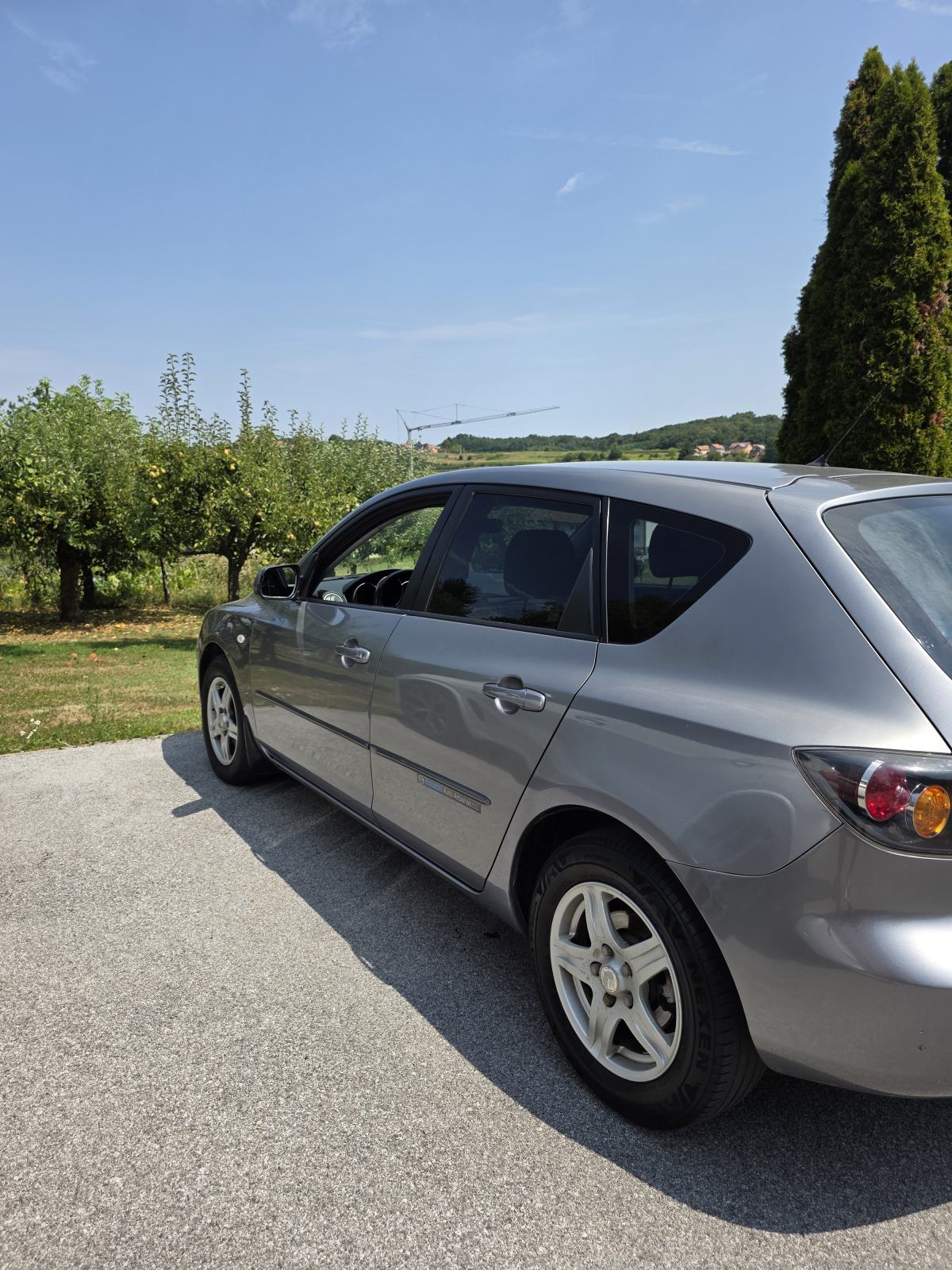 Mazda 3 Sport 1,4 i CE, fotografija 4