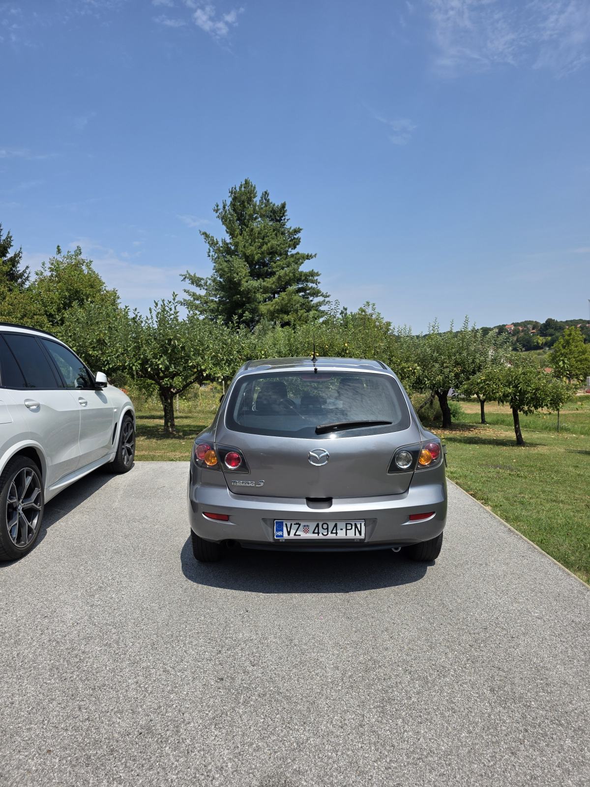 Mazda 3 Sport 1,4 i CE, fotografija 3