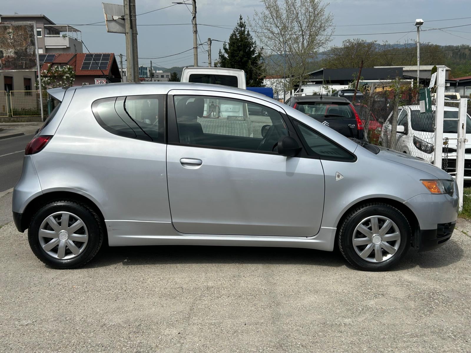 Mitsubishi Colt 1.1 2013g. 87.000km. klima....grijanje sjedala..., fotografija 4
