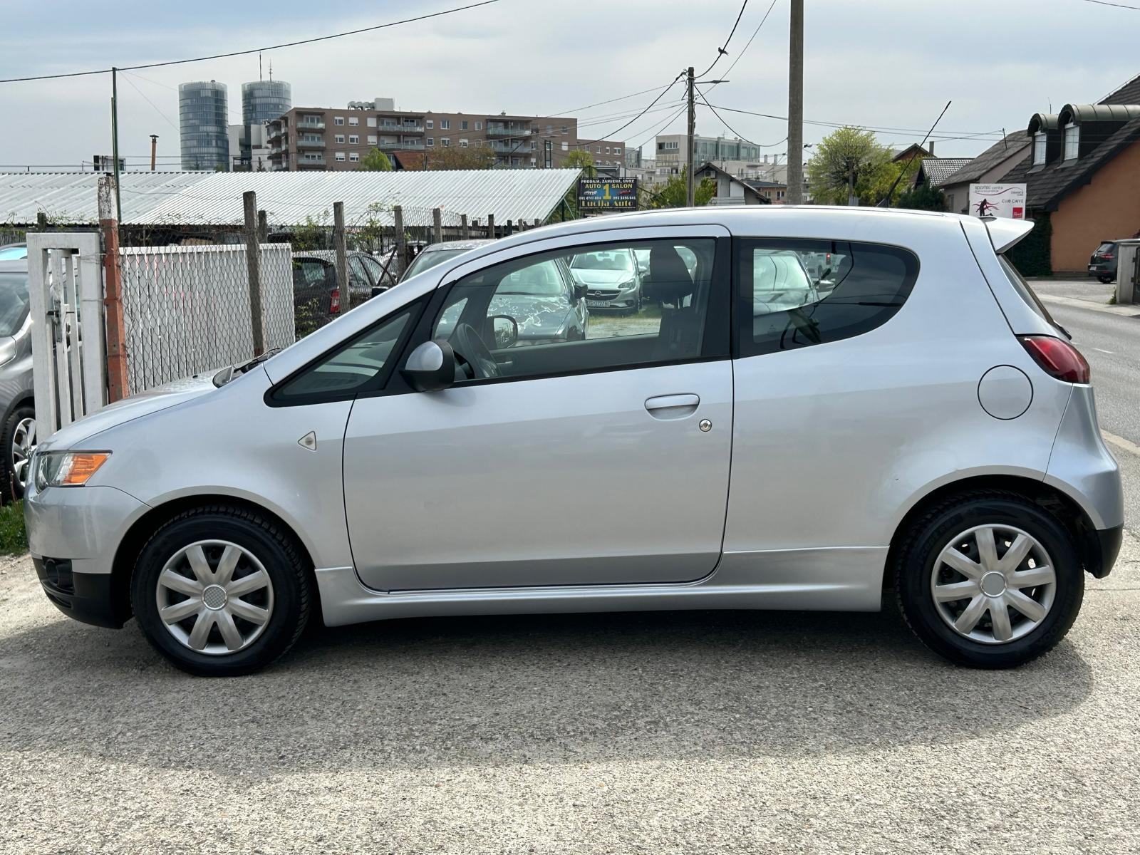 Mitsubishi Colt 1.1 2013g. 87.000km. klima....grijanje sjedala..., fotografija 7