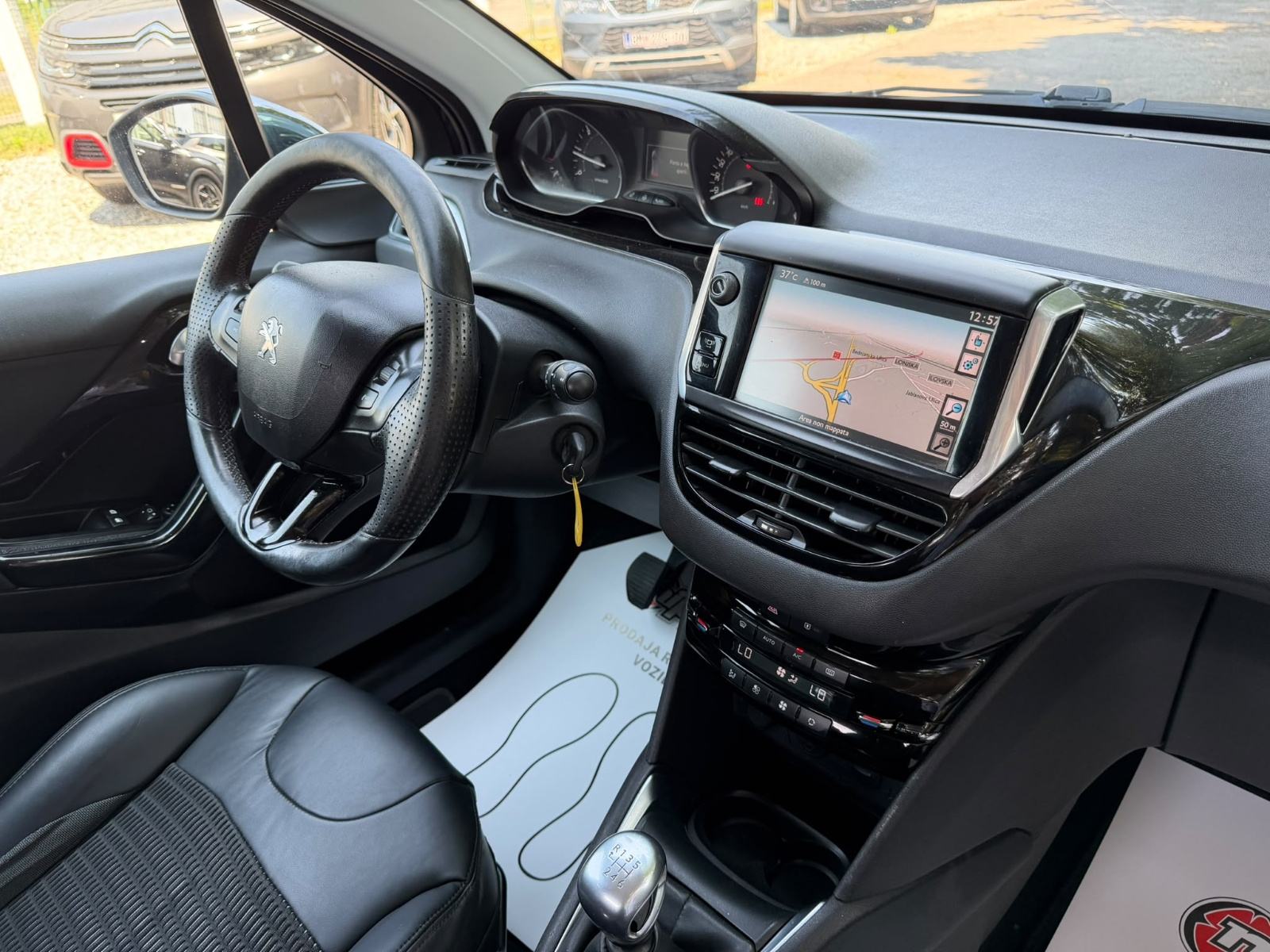 Peugeot 208 1,6 e-HDi - NAVI - KLIMA - TEMPOMAT - REGISTRIRAN, fotografija 17